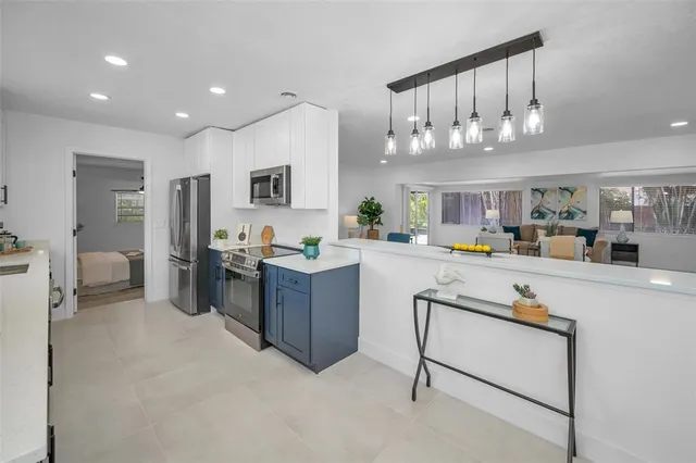 a view of kitchen with furniture and window