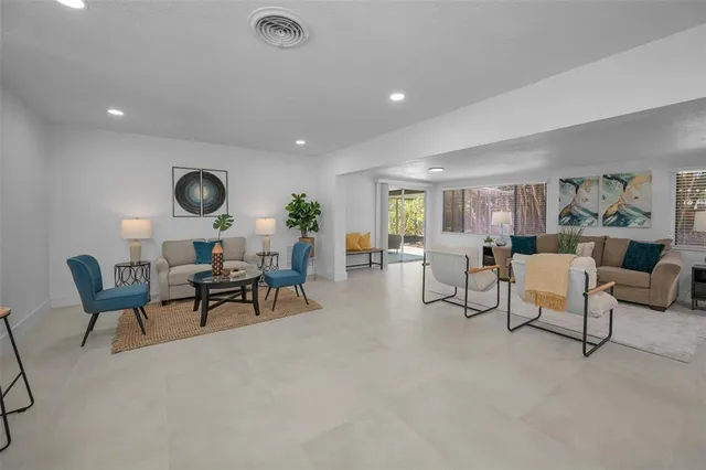 a living room with furniture and a table