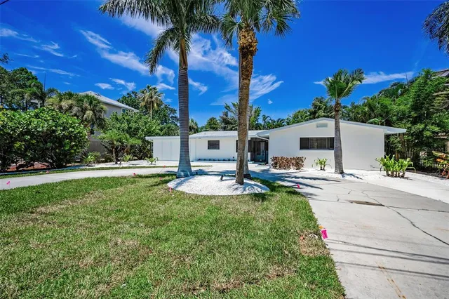 a swimming pool with outdoor seating and yard