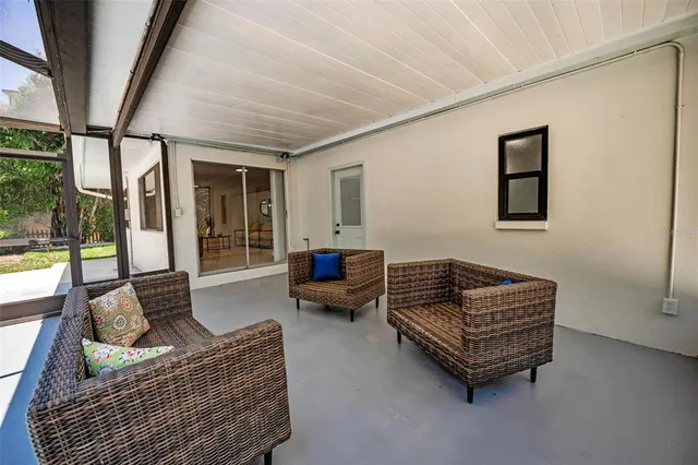 a view of a backyard with a large tree