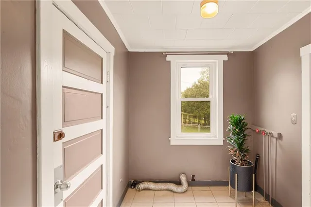 a view of a bedroom with a window and chair