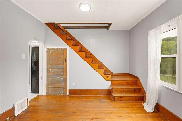 a view of an empty room with stairs