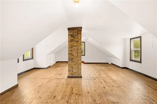 a view of an empty room with windows