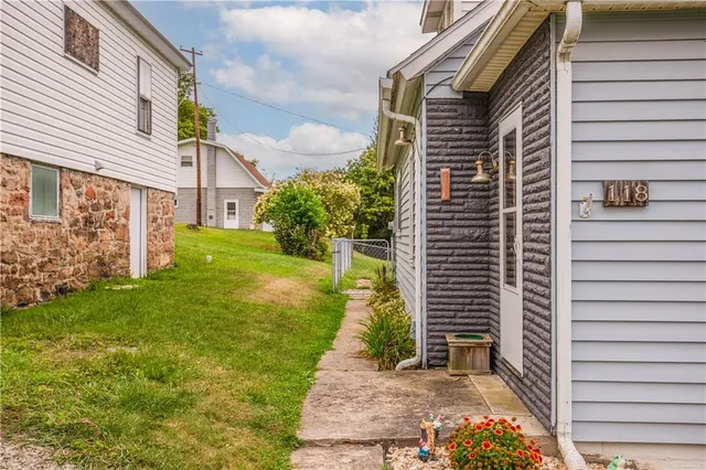 a view of a back yard of the house