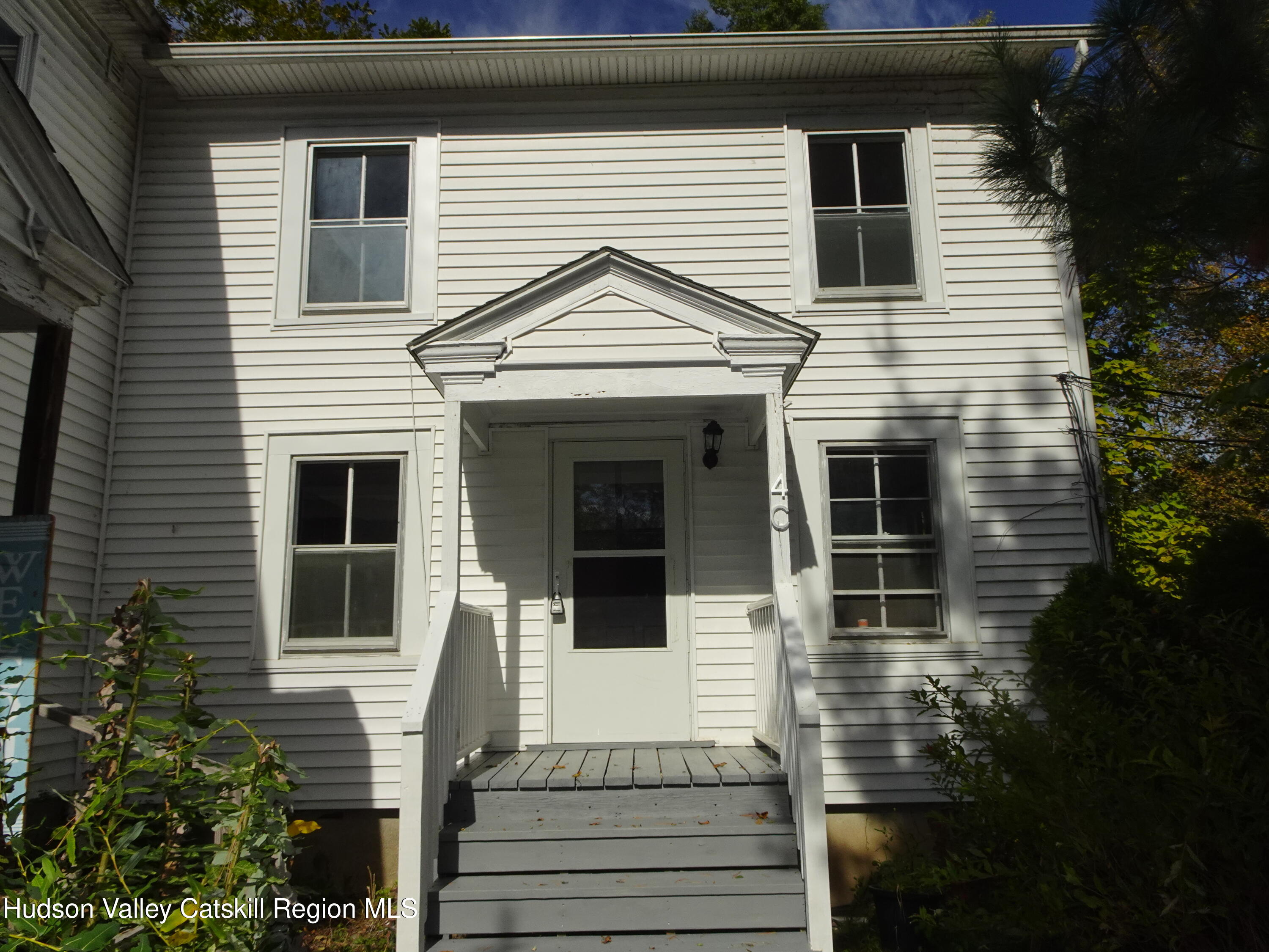 167 Highway 23, Unit 4C Claverack, NY 12513 - Photo 1 of 25 a front view of a house with a yard