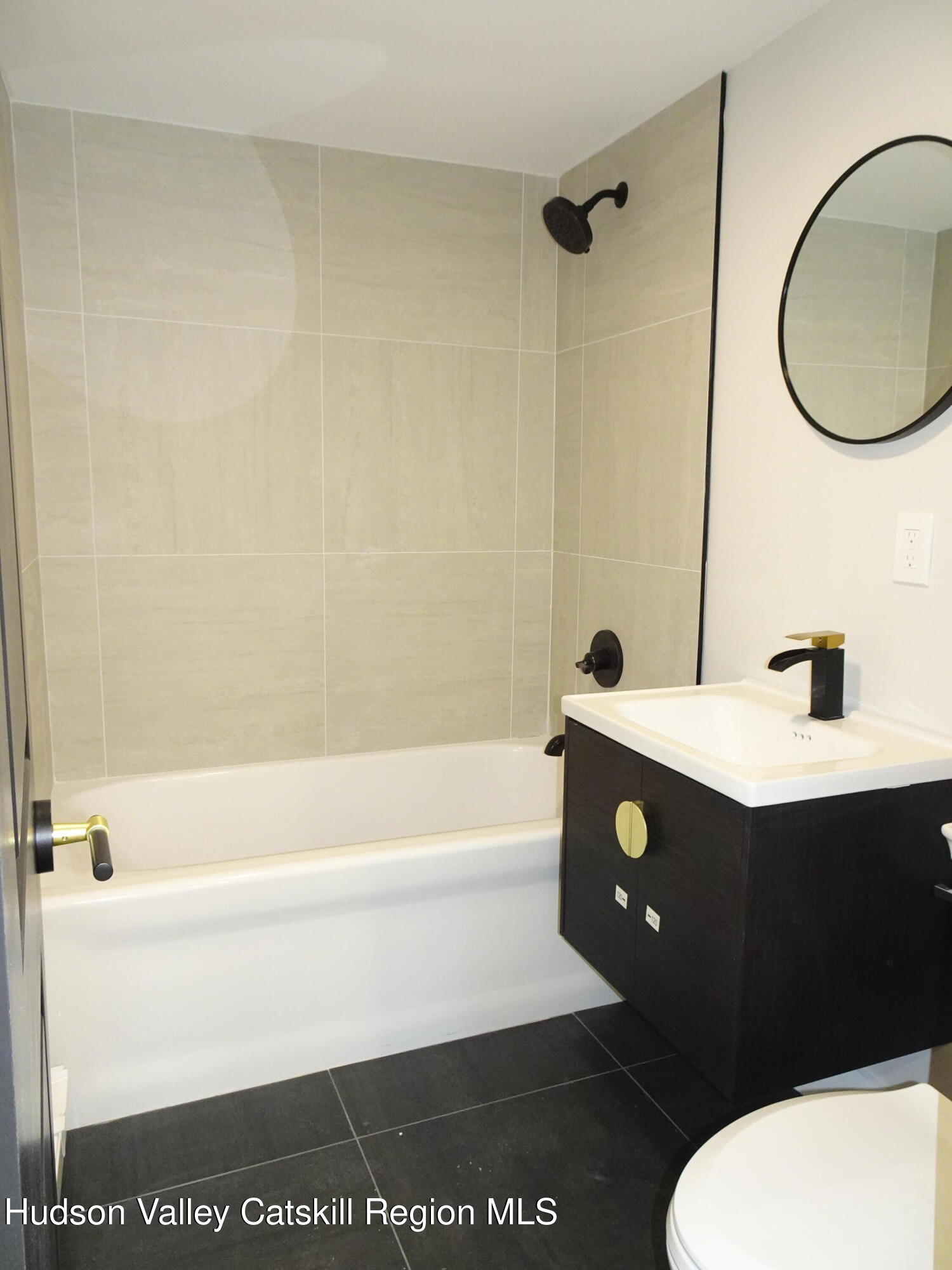 167 Highway 23, Unit 4C Claverack, NY 12513 - Photo 12 of 25 a bathroom with a sink a toilet and bathtub