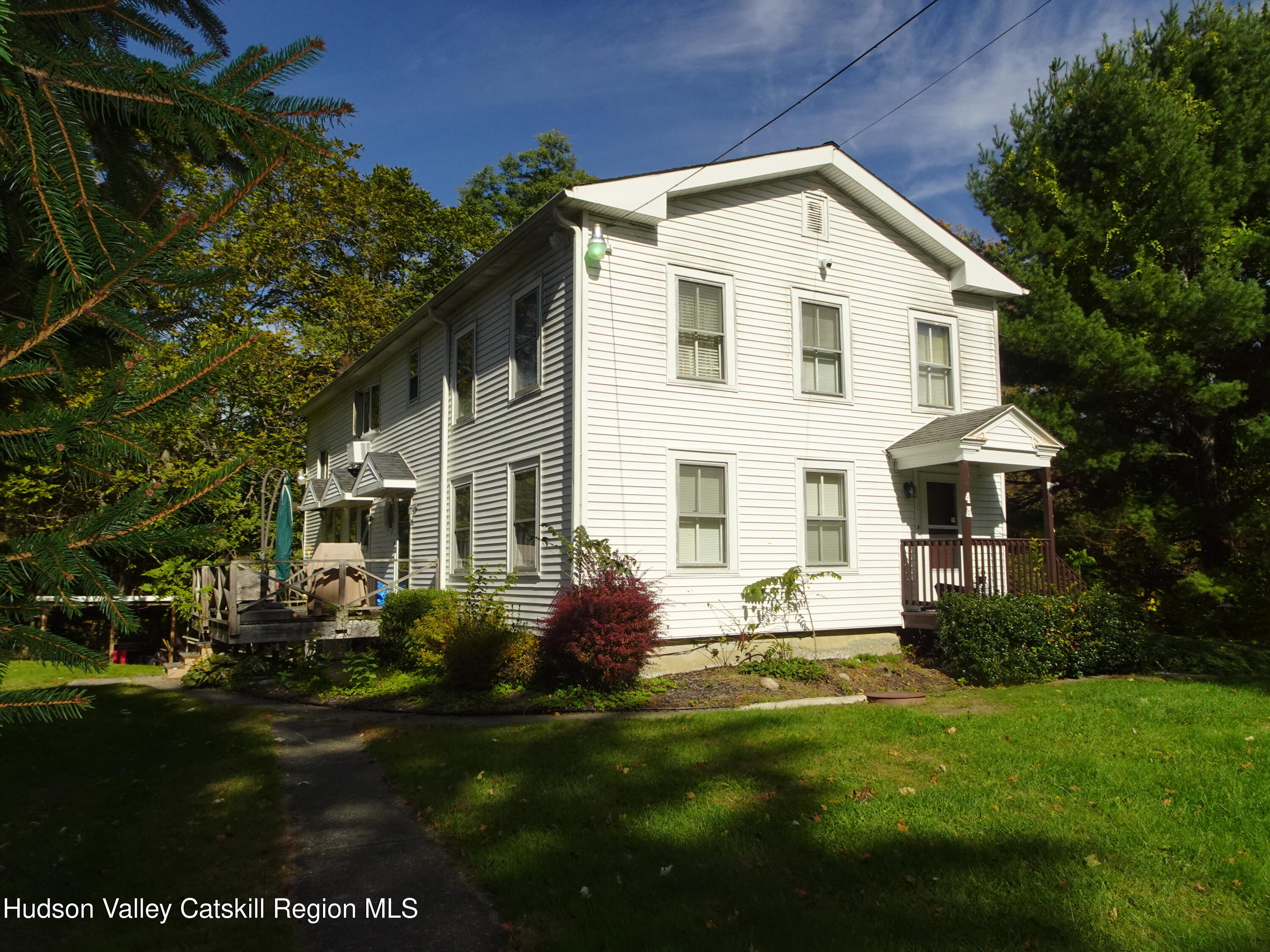 167 Highway 23, Unit 4C Claverack, NY 12513 - Photo 19 of 25 a front view of house with yard and green space