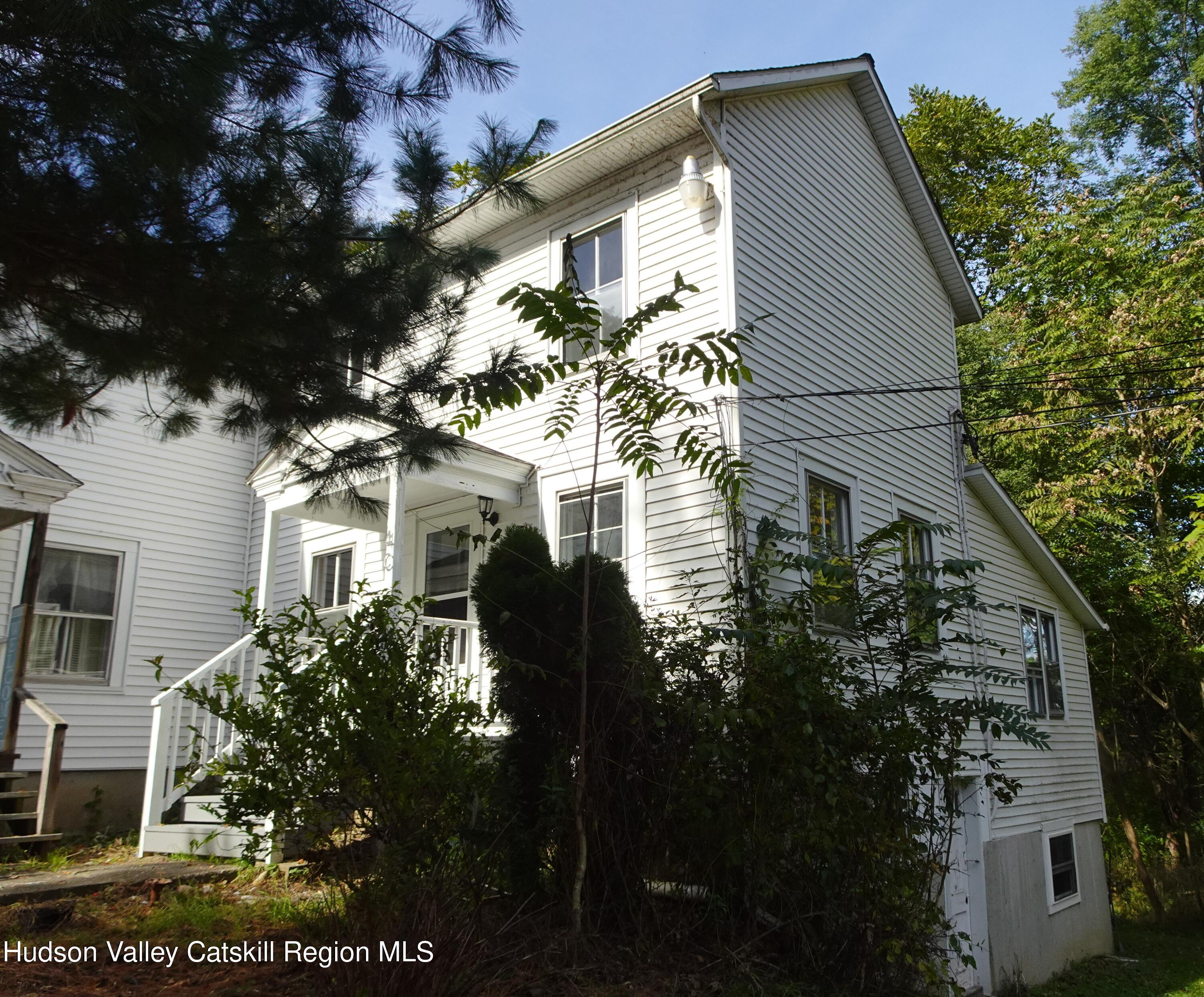 167 Highway 23, Unit 4C Claverack, NY 12513 - Photo 22 of 25 a front view of a house with a garden