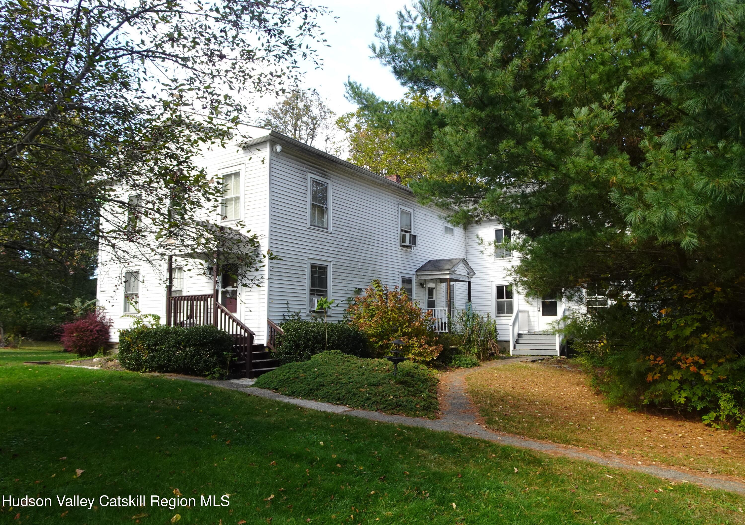 167 Highway 23, Unit 4C Claverack, NY 12513 - Photo 24 of 25 a view of house in front of a big yard with large trees