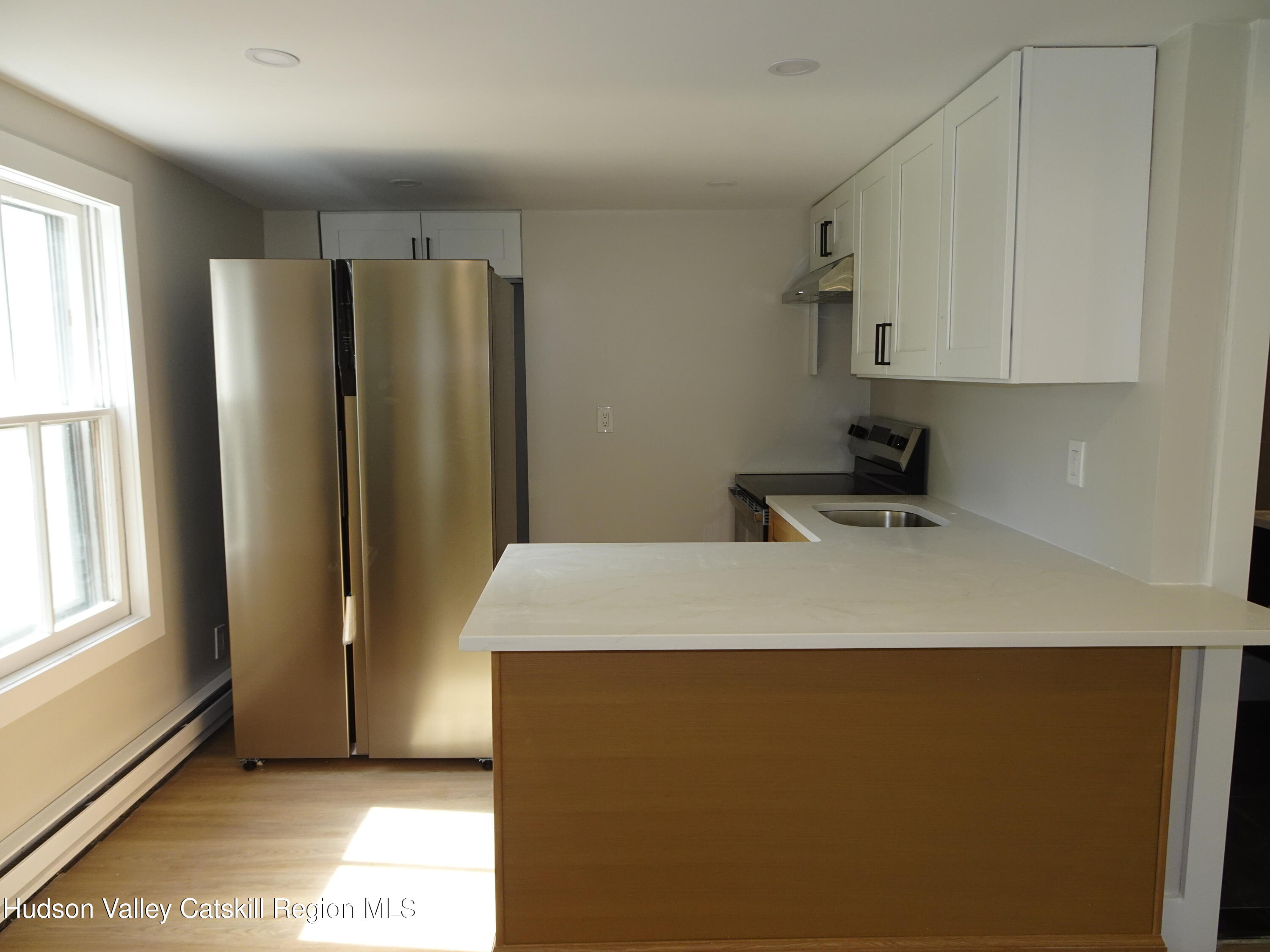 167 Highway 23, Unit 4C Claverack, NY 12513 - Photo 5 of 25 a room with a bed and a window