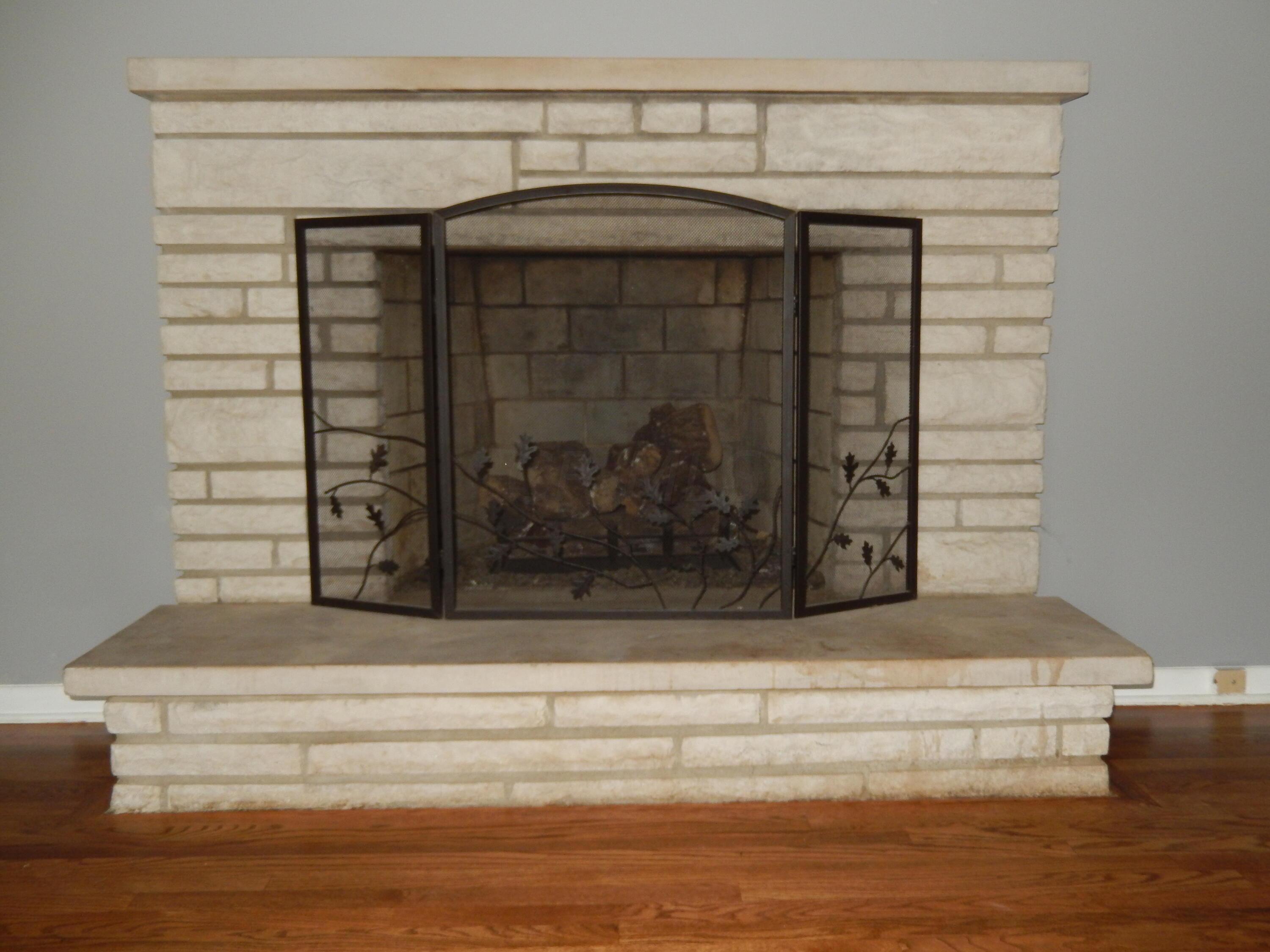 5587 Hazelwood Road Columbus, OH 43229 - Photo 8 of 47 Living Room Stone Fireplace with gas logs