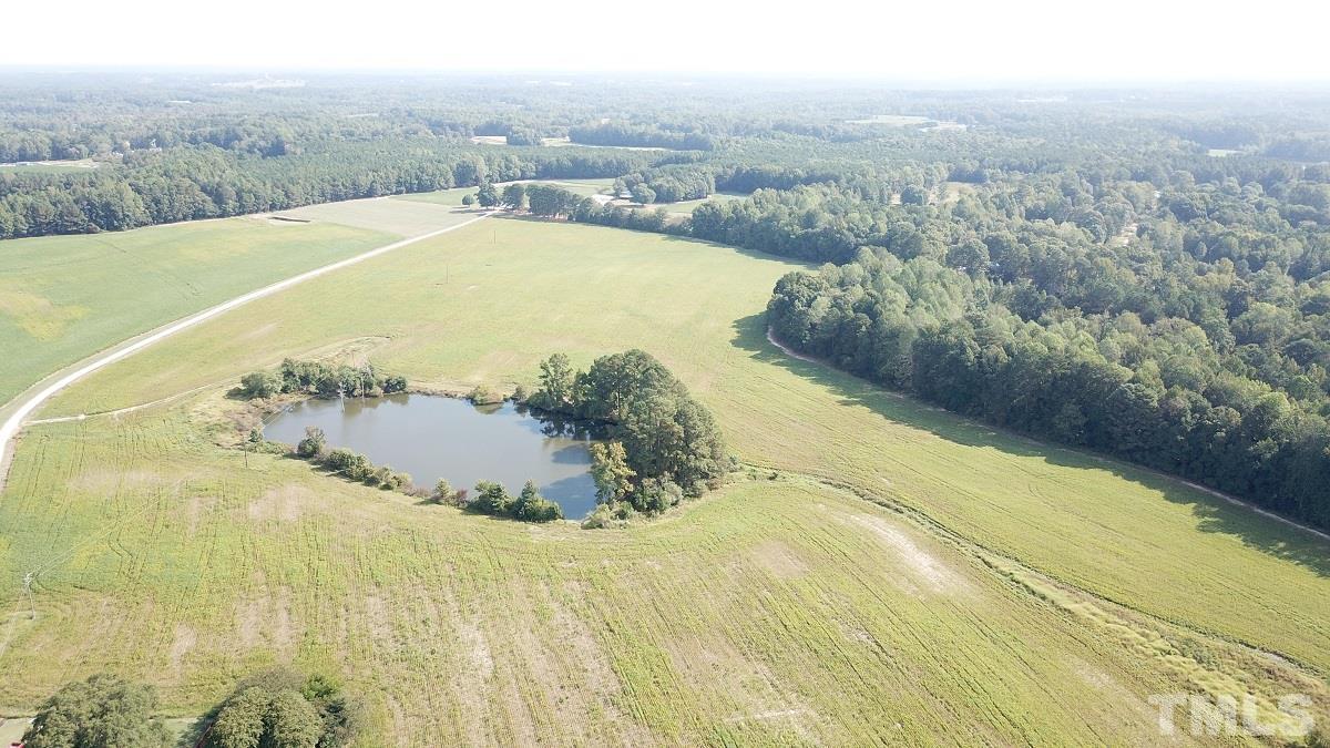 47.52-acres Pilot-Riley Road Zebulon, NC 27597 - Photo 2 of 22 a view of a swimming pool with a yard