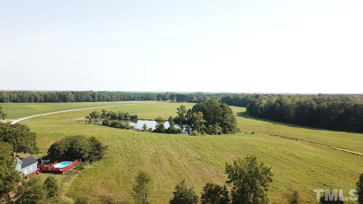 47.52-acres Pilot-Riley Road Zebulon, NC 27597 - Photo 17 of 22 a view of a lake with a yard