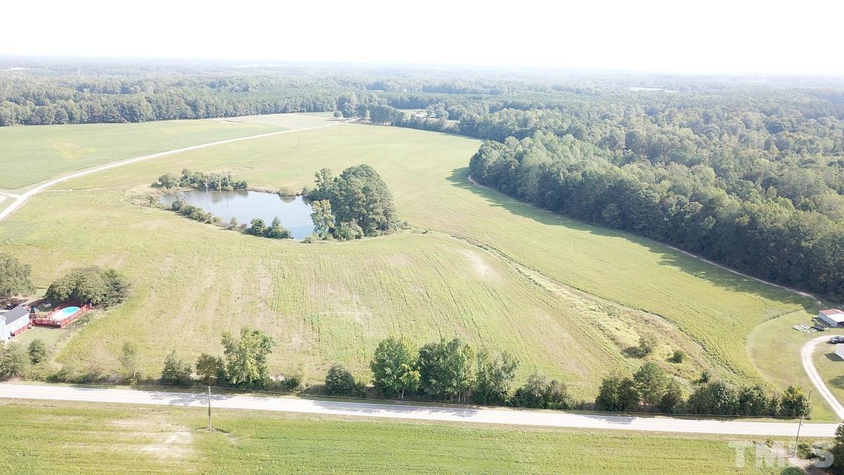 47.52-acres Pilot-Riley Road Zebulon, NC 27597 - Photo 20 of 22 a view of a swimming pool with an ocean view