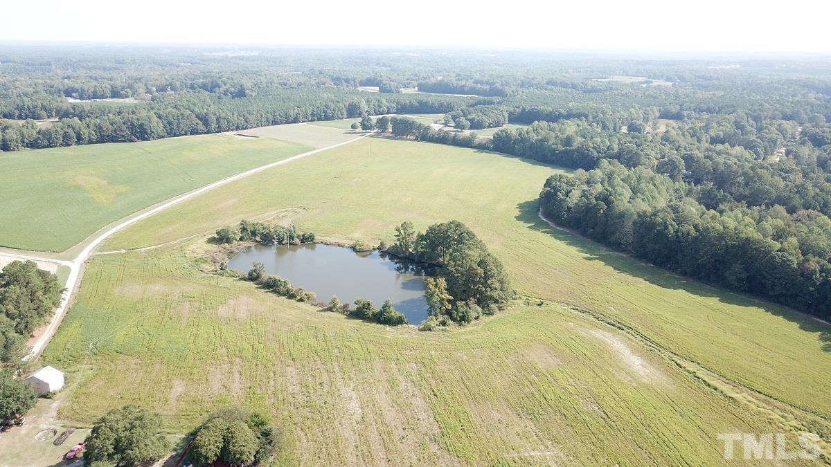 47.52-acres Pilot-Riley Road Zebulon, NC 27597 - Photo 3 of 22 a view of a swimming pool with a yard