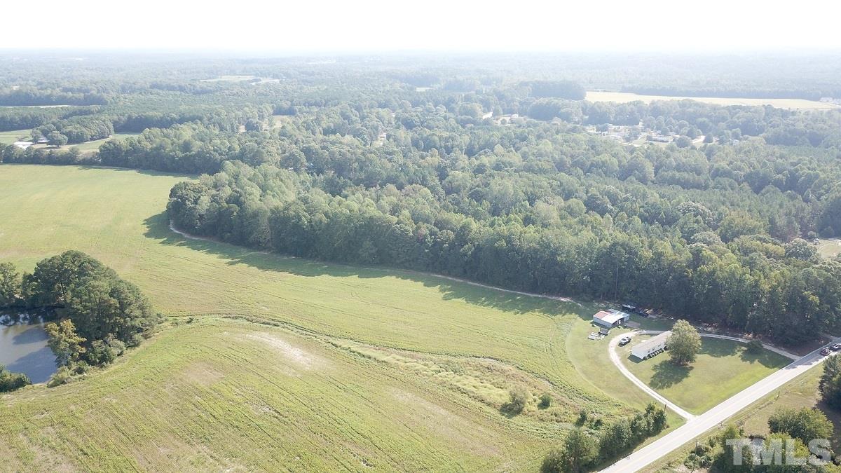 47.52-acres Pilot-Riley Road Zebulon, NC 27597 - Photo 4 of 22 a view of a swimming pool with a yard