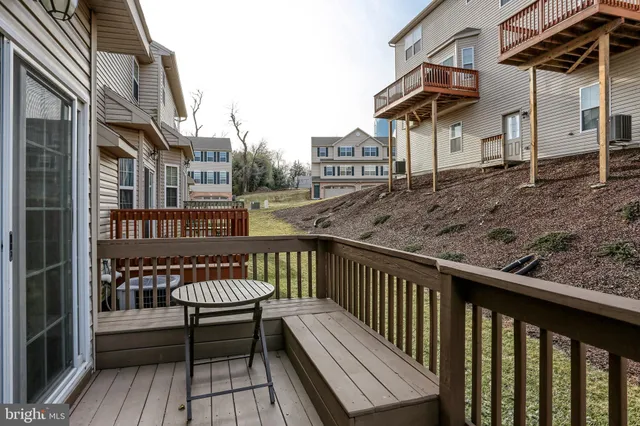 a view of a wooden deck with a yard