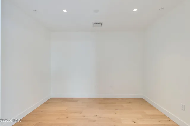 an aerial view of a house with a yard and lake view