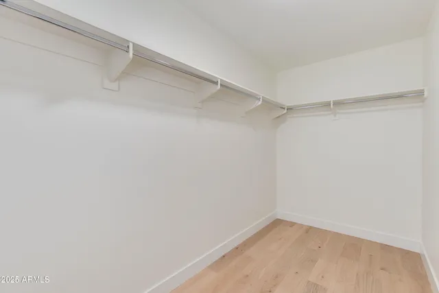 a view of a terrace with lawn chairs and a fire pit