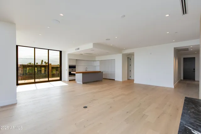a living room with kitchen furniture and a couch