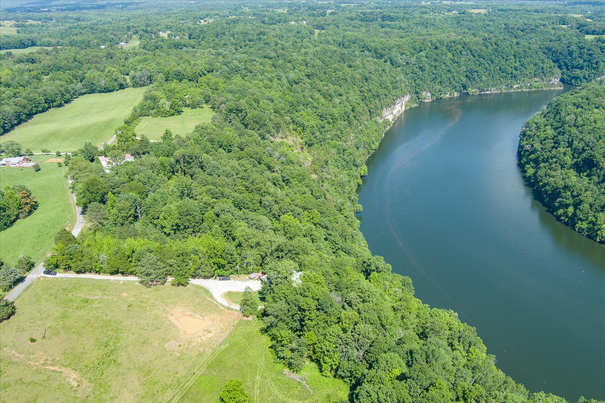 689 Pates Ford Road Walling, TN 38587 - Photo 5 of 10 a view of a lake with a yard