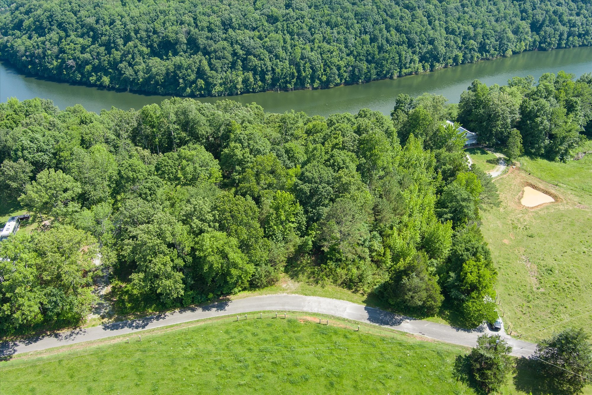 689 Pates Ford Road Walling, TN 38587 - Photo 6 of 10 a view of a garden with a lake
