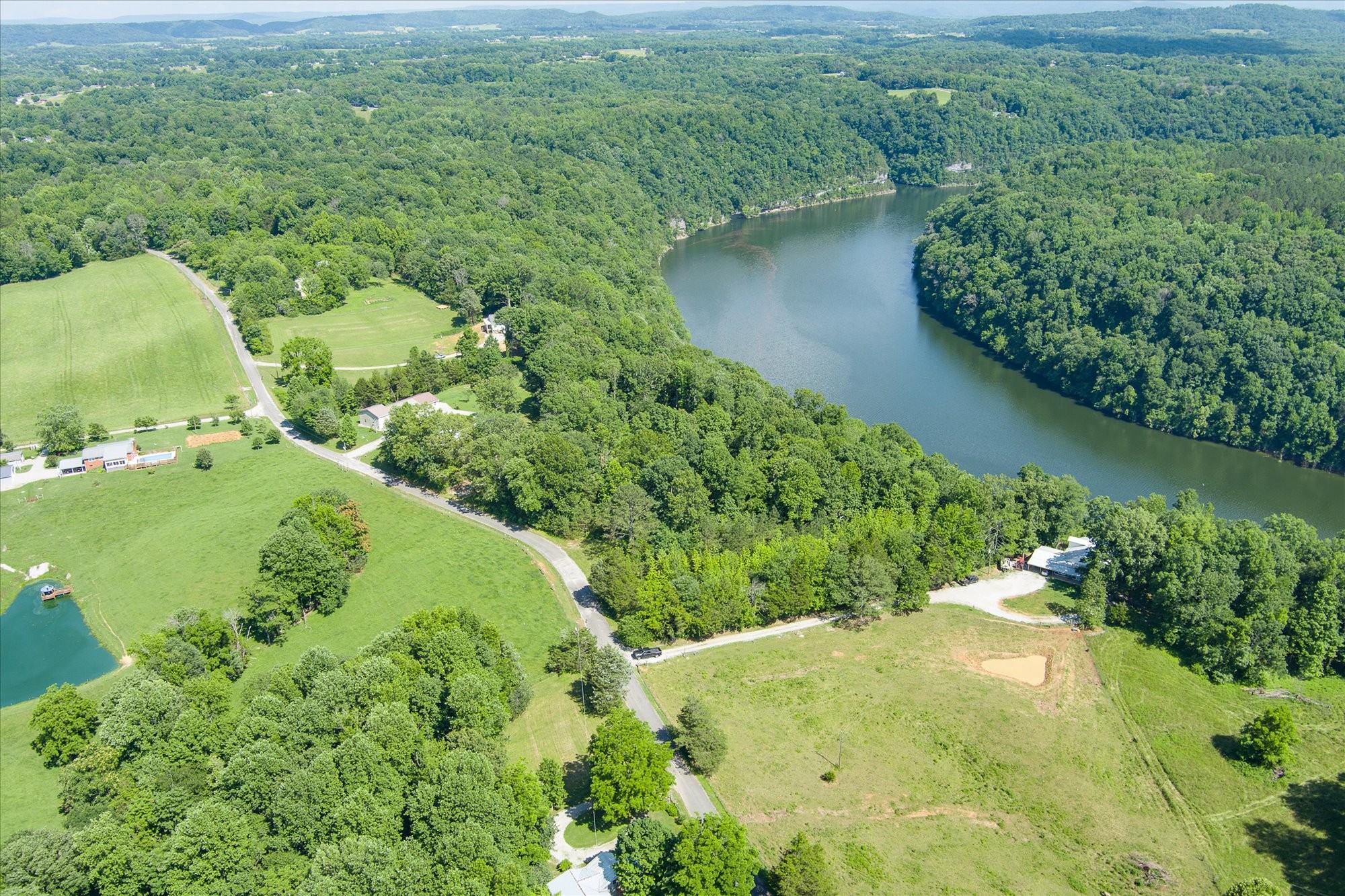 689 Pates Ford Road Walling, TN 38587 - Photo 7 of 10 a view of a garden with a lake