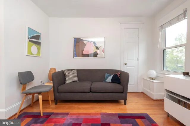 a living room with furniture and a rug
