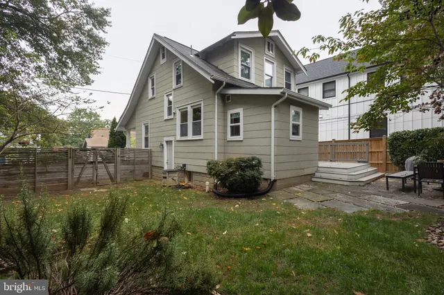 a view of a backyard with plants and a garden