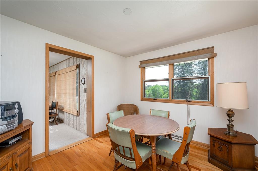109 Hillcrest Road Renfrew, PA 16053 - Photo 13 of 30 a view of a dining room with furniture window and wooden floor