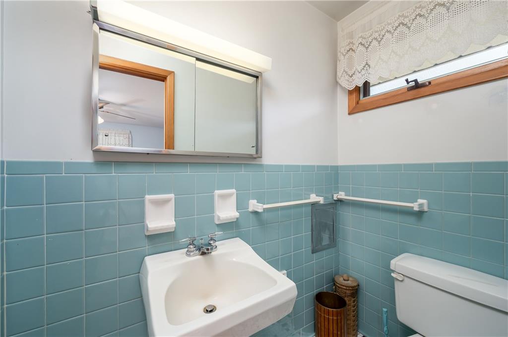 109 Hillcrest Road Renfrew, PA 16053 - Photo 20 of 30 a bathroom with a sink a toilet and mirror