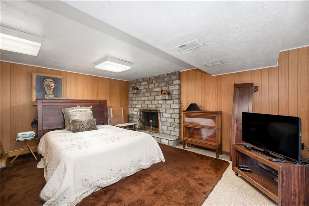 109 Hillcrest Road Renfrew, PA 16053 - Photo 21 of 30 a bedroom with a bed and a flat screen tv