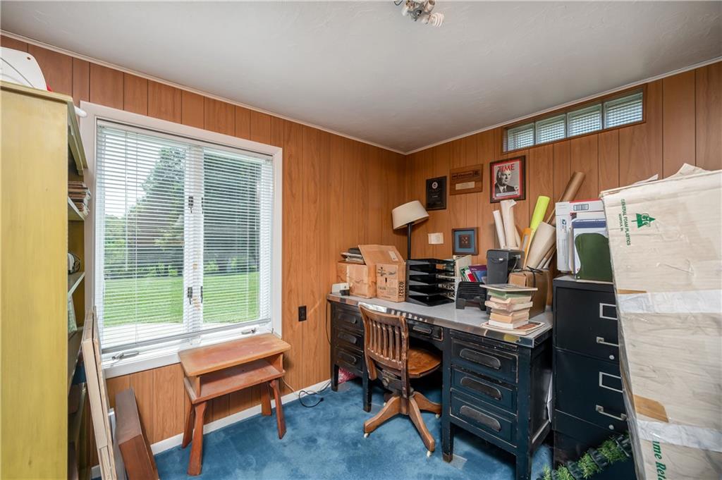109 Hillcrest Road Renfrew, PA 16053 - Photo 22 of 30 a room with a desk a chair and a potted plant