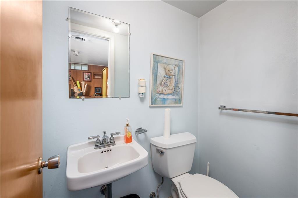 109 Hillcrest Road Renfrew, PA 16053 - Photo 23 of 30 a bathroom with a toilet a sink and mirror