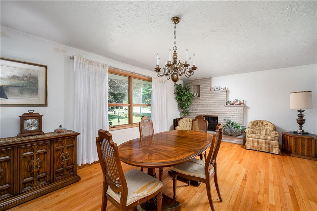 109 Hillcrest Road Renfrew, PA 16053 - Photo 3 of 30 a view of a dining room with furniture window and wooden floor