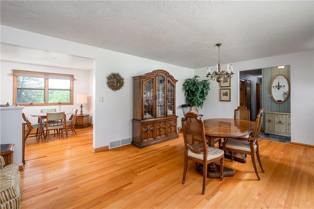 109 Hillcrest Road Renfrew, PA 16053 - Photo 5 of 30 a view of a dining room with furniture and wooden floor