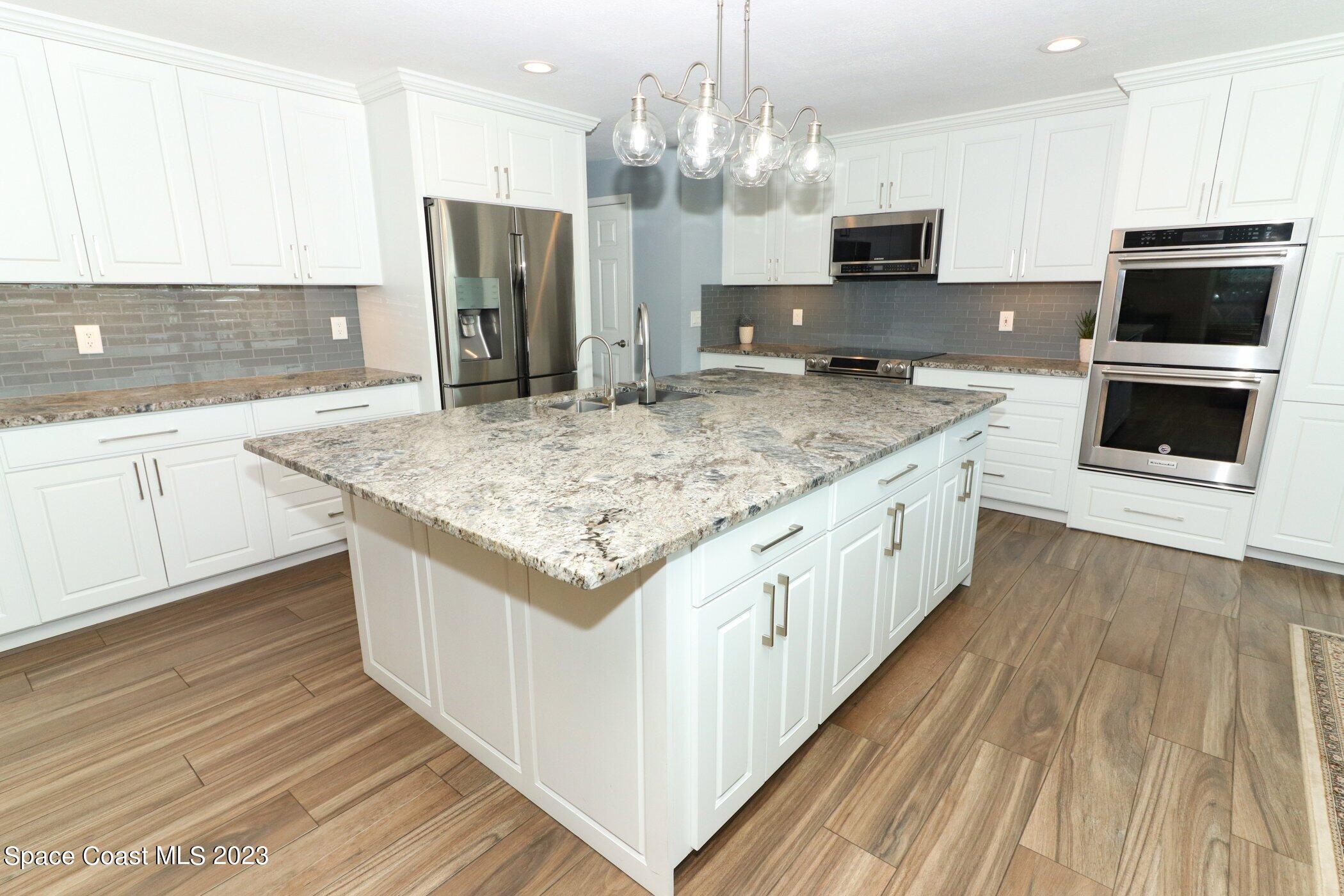 834 Egret Road Cocoa, FL 32926 - Photo 15 of 85 41023997-015-Kitchen_Alt_View