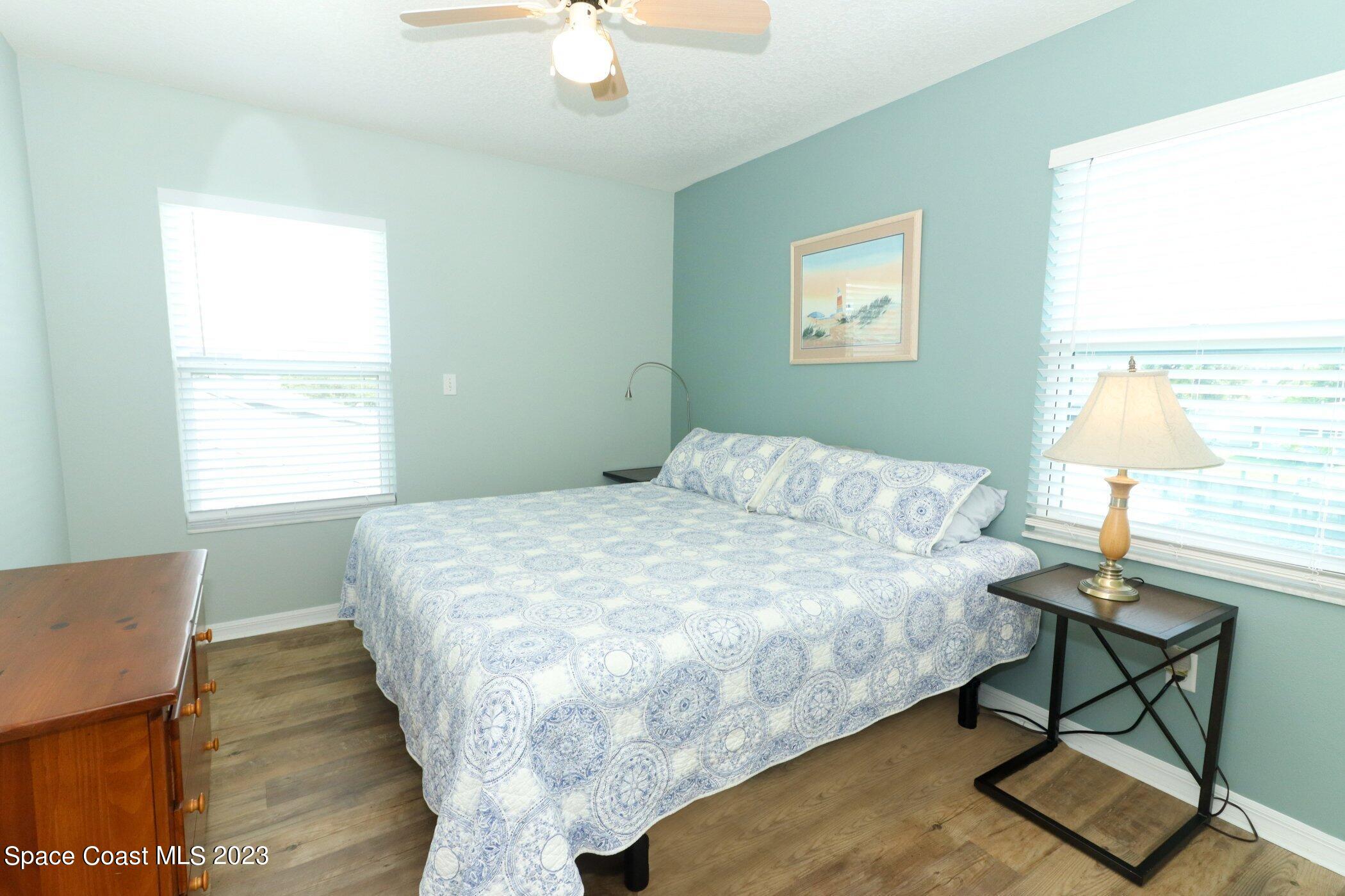 834 Egret Road Cocoa, FL 32926 - Photo 33 of 85 a bed sitting in a bedroom next to a window