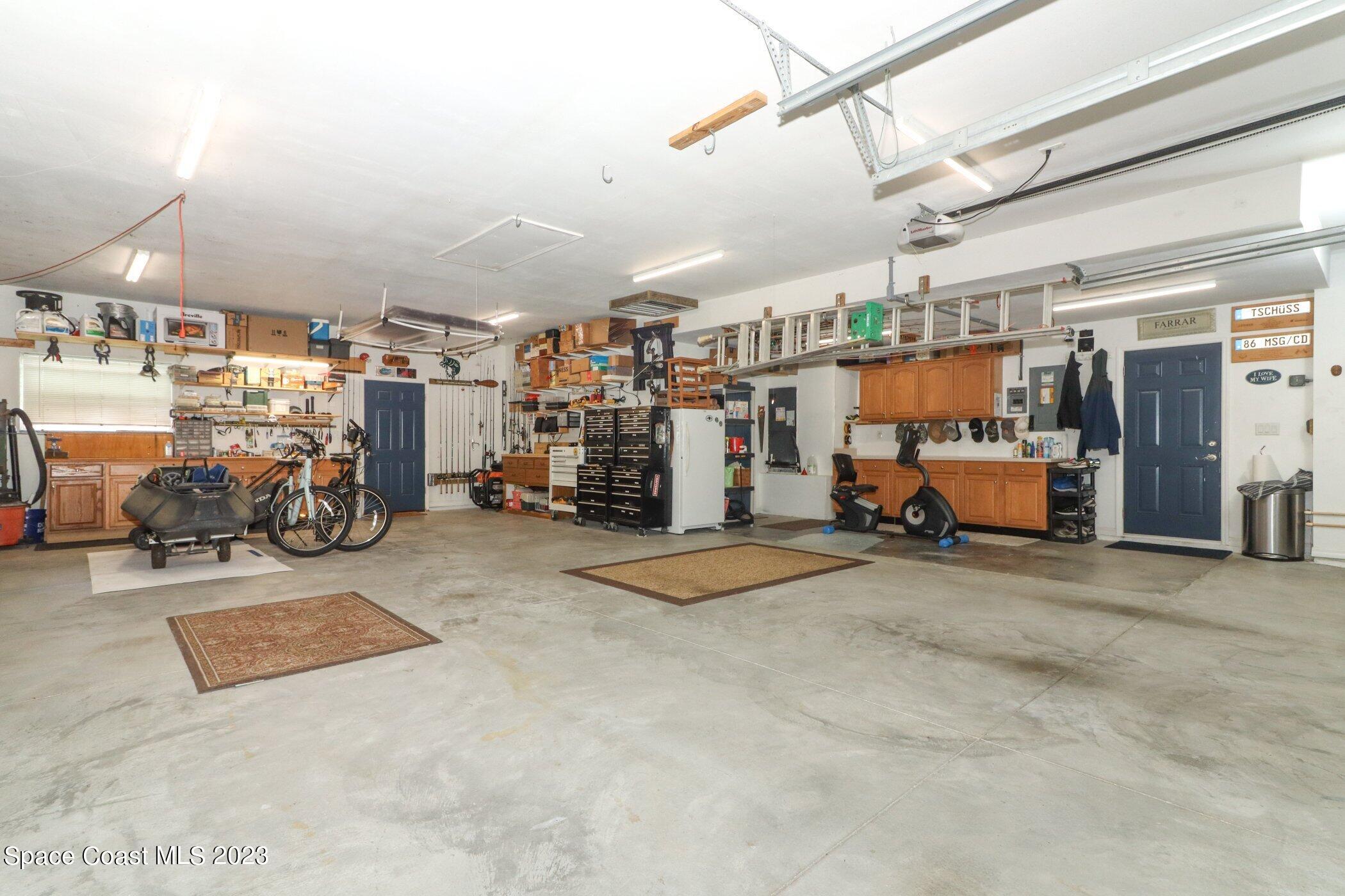 834 Egret Road Cocoa, FL 32926 - Photo 36 of 85 a view of parking garage with cars