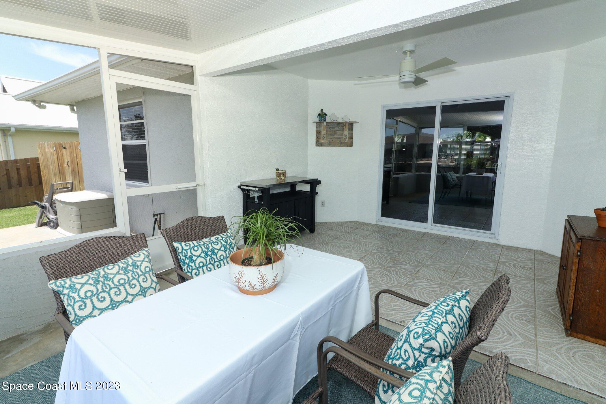 834 Egret Road Cocoa, FL 32926 - Photo 40 of 85 a view of a dining room with furniture