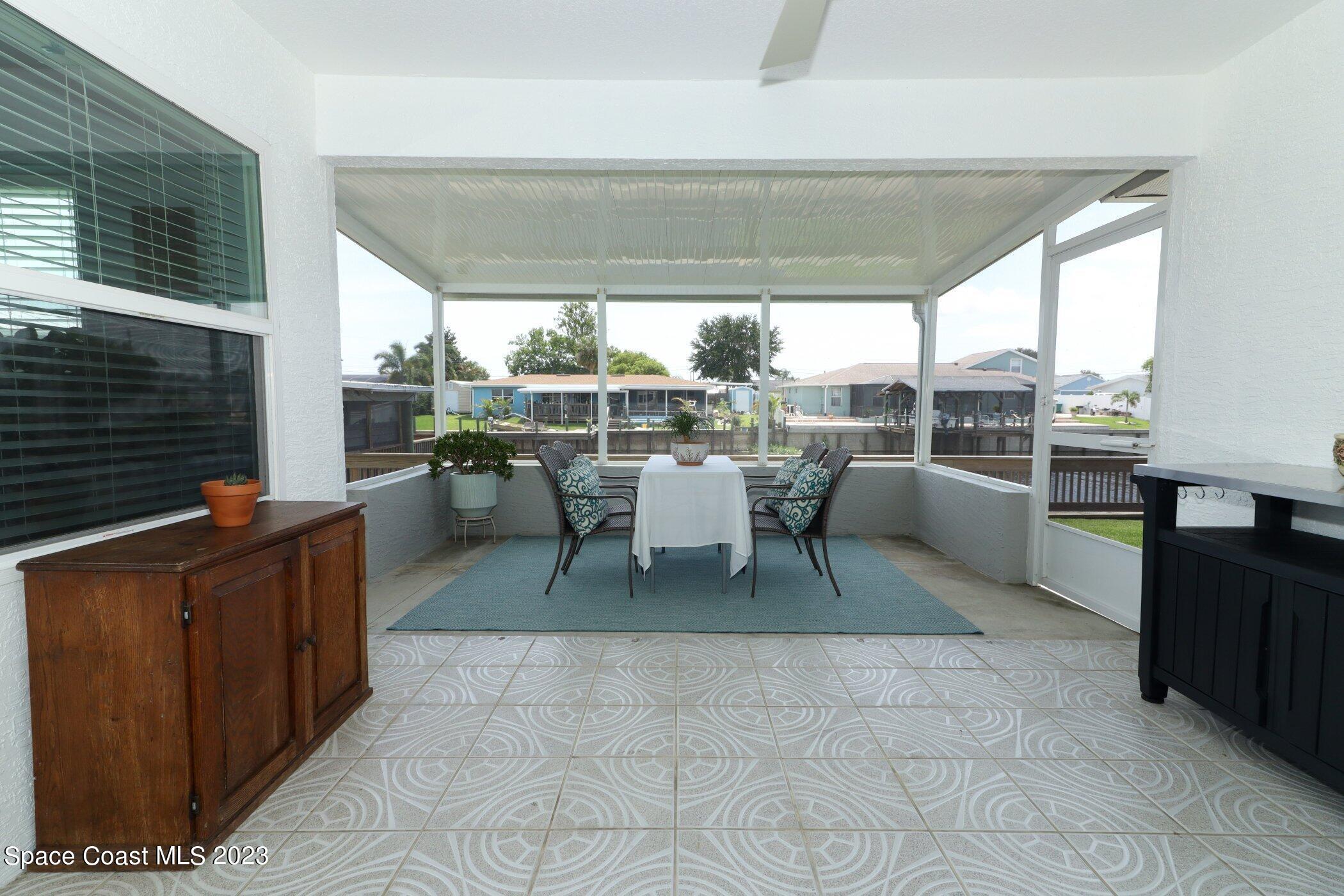 834 Egret Road Cocoa, FL 32926 - Photo 41 of 85 41023997-041-Screened_Patio_Alt_View