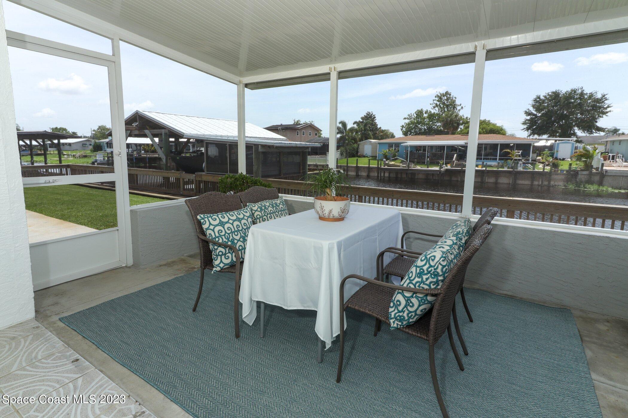 834 Egret Road Cocoa, FL 32926 - Photo 42 of 85 41023997-042-Screened_Patio_Alt_View