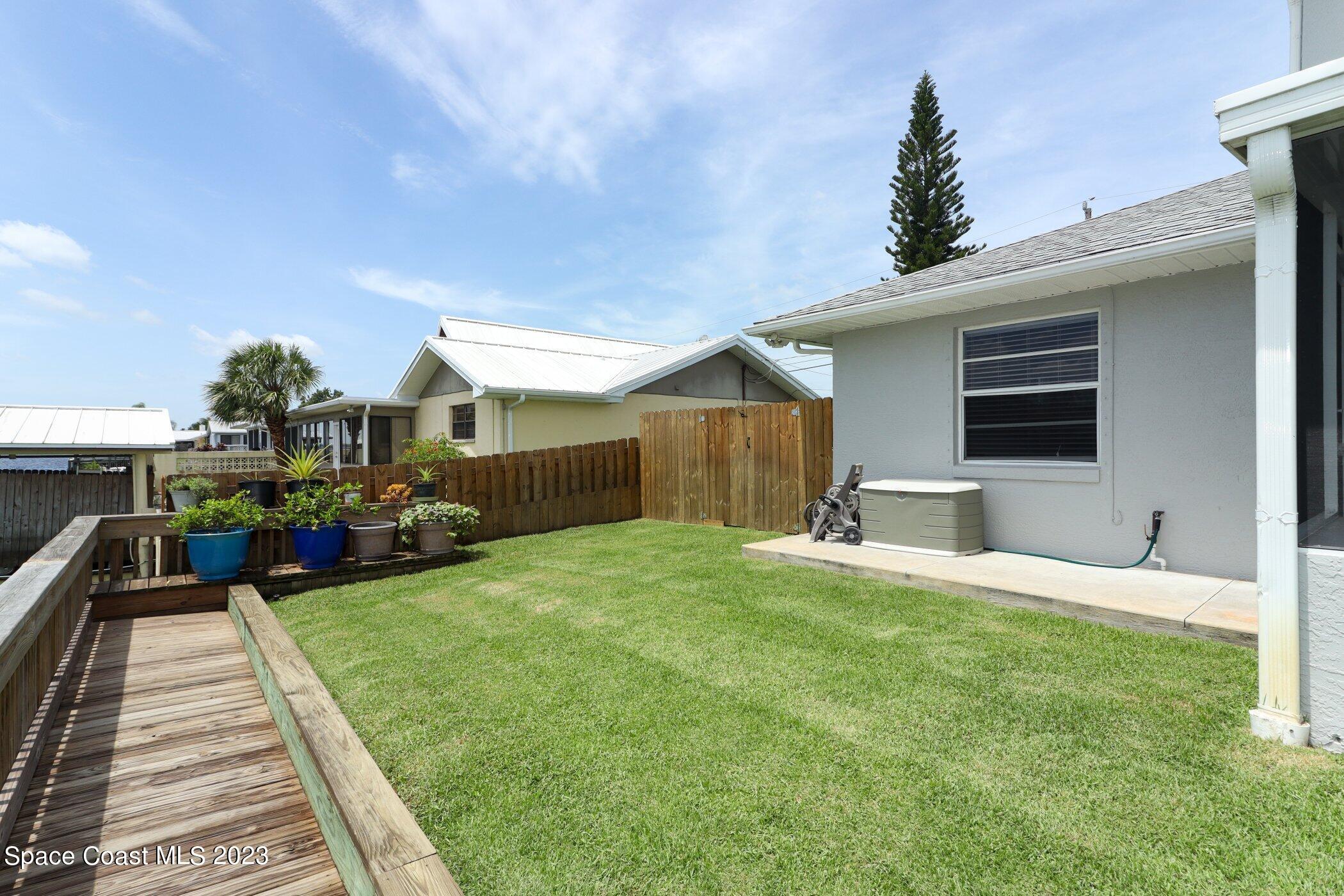 834 Egret Road Cocoa, FL 32926 - Photo 44 of 85 a view of a house with backyard and porch
