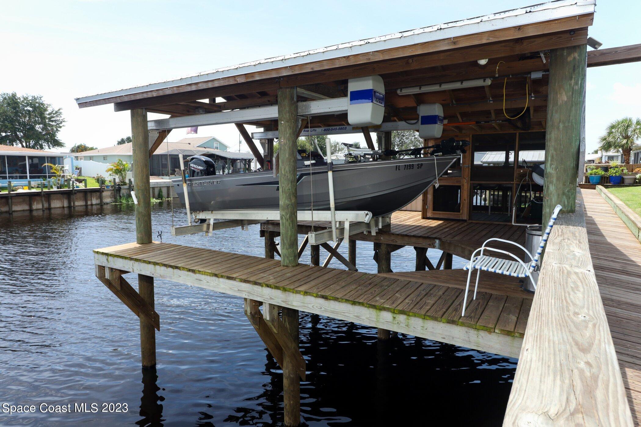 834 Egret Road Cocoa, FL 32926 - Photo 48 of 85 a roof deck with table and chairs