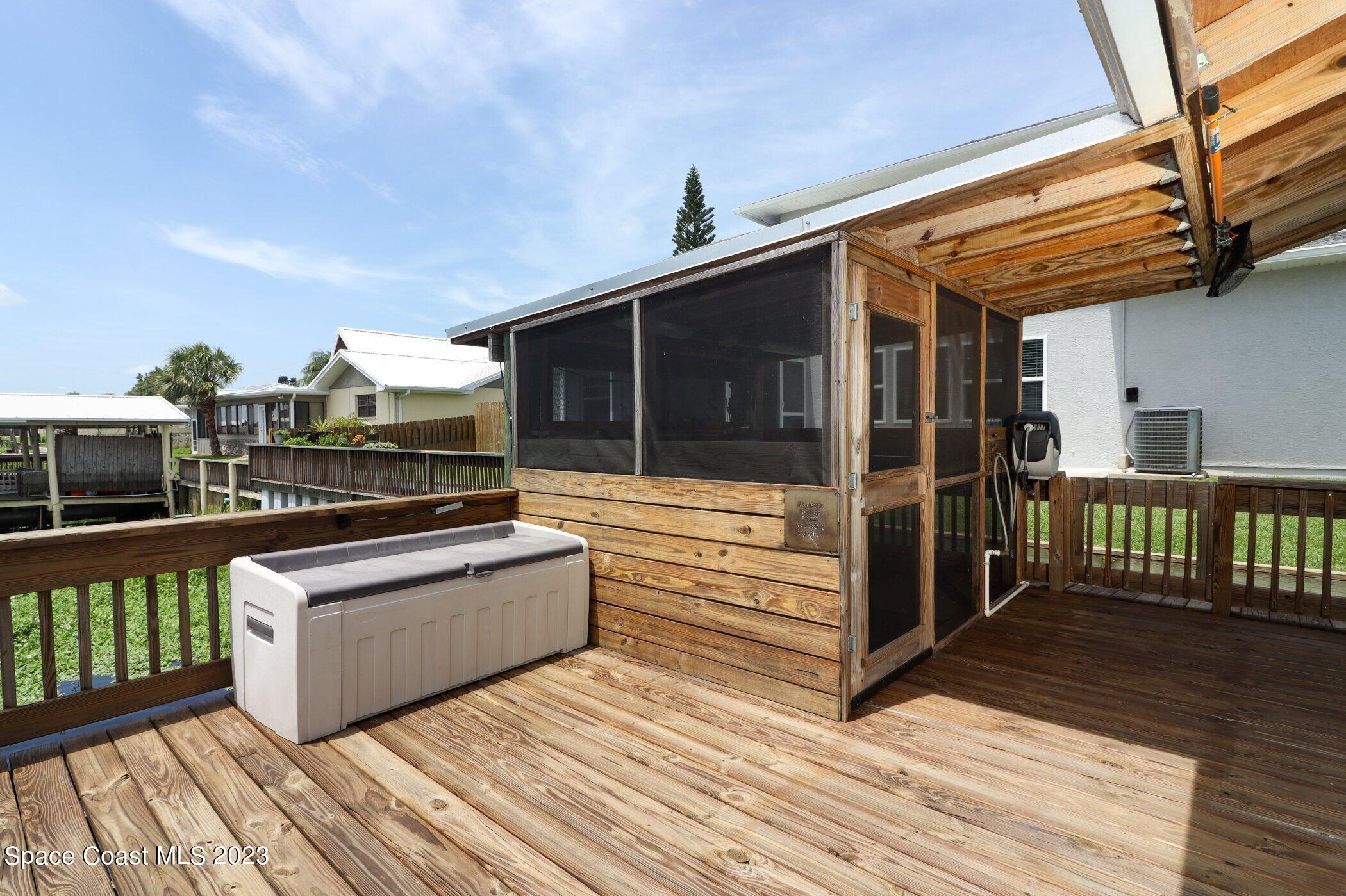 834 Egret Road Cocoa, FL 32926 - Photo 50 of 85 a view of a terrace with wooden floor and furniture