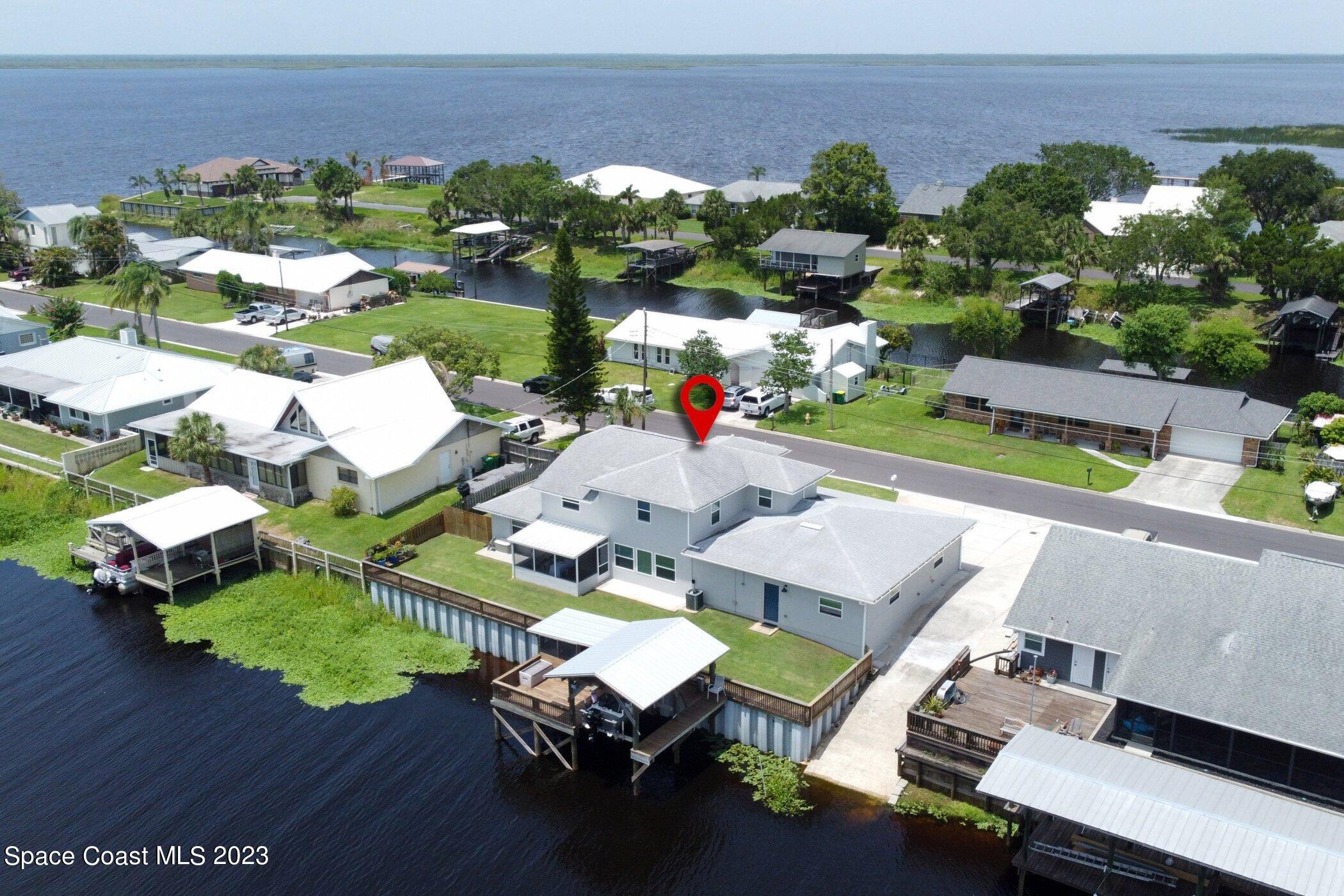 834 Egret Road Cocoa, FL 32926 - Photo 61 of 85 an aerial view of a house with a swimming pool patio and outdoor seating