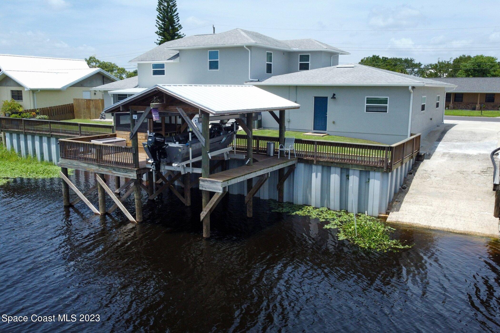 834 Egret Road Cocoa, FL 32926 - Photo 63 of 85 a view of a patio with furniture and wooden floor