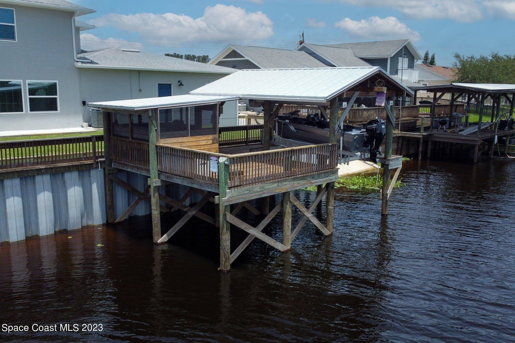 834 Egret Road Cocoa, FL 32926 - Photo 65 of 85 a dining room with furniture and wooden floor