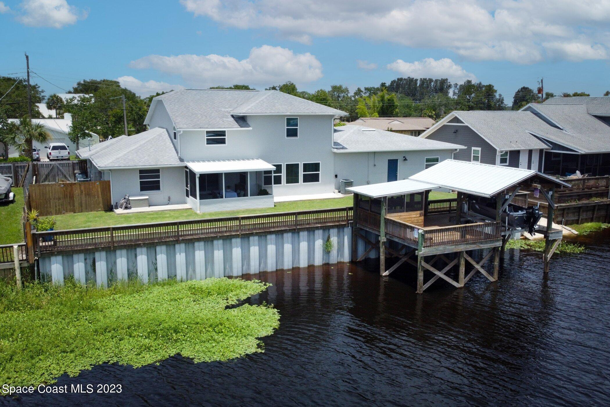 834 Egret Road Cocoa, FL 32926 - Photo 66 of 85 a view of a patio with furniture and a table