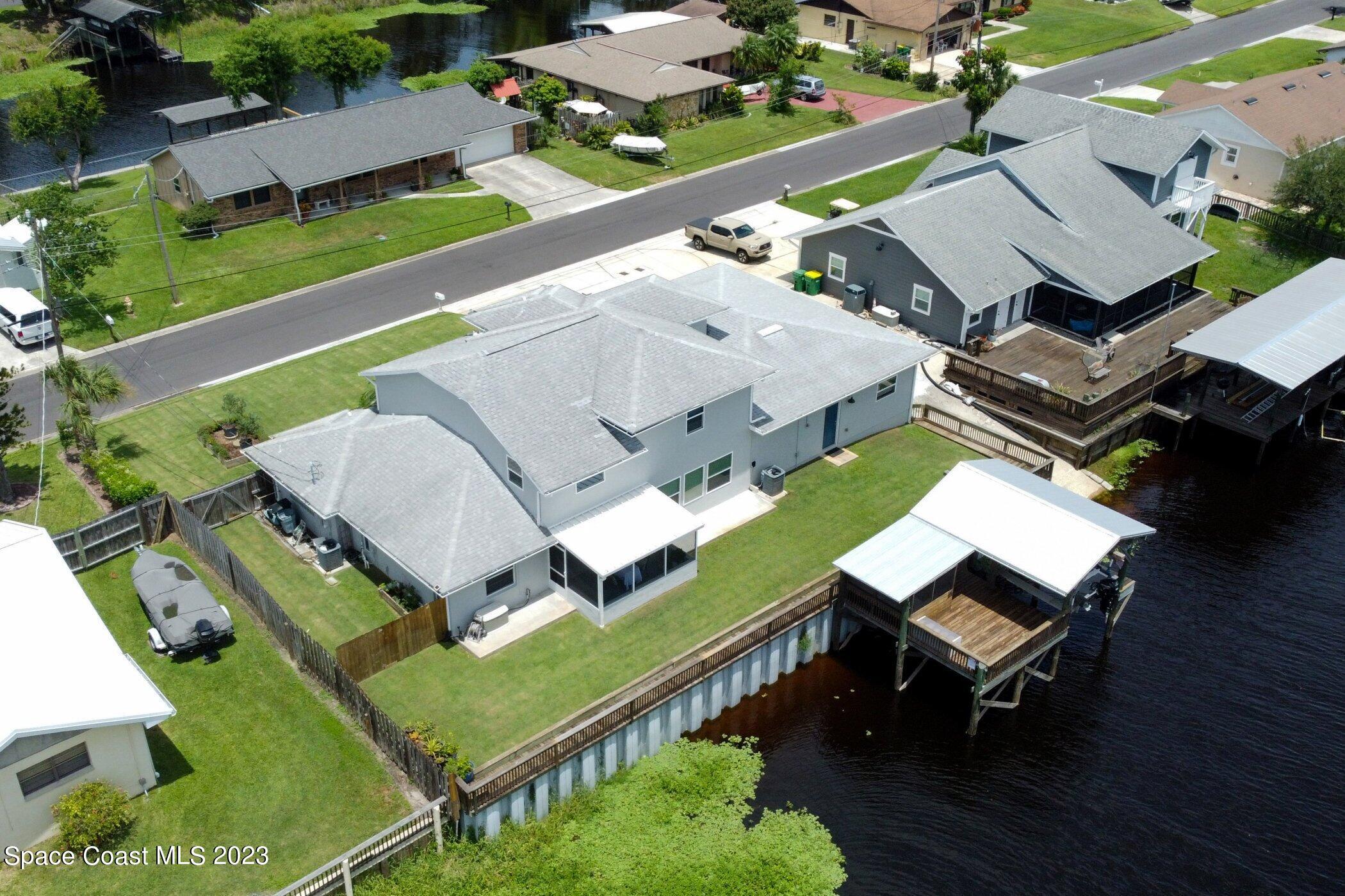 834 Egret Road Cocoa, FL 32926 - Photo 69 of 85 an aerial view of a house with pool outdoor seating